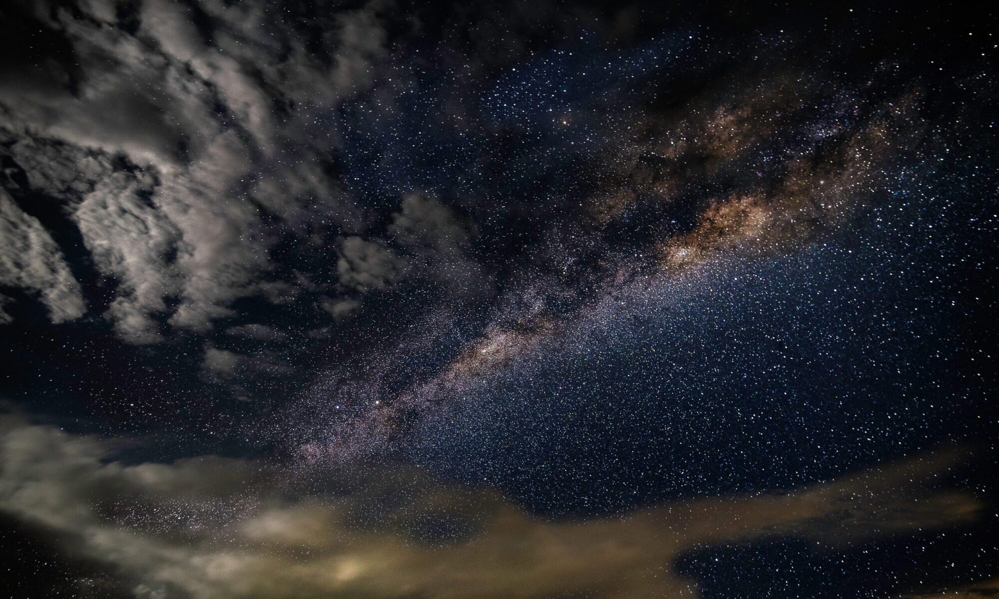 Clouds part to reveal cosmic starry sky